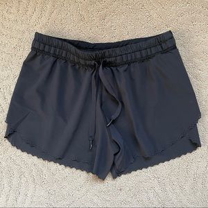 worn lululemon black shorts